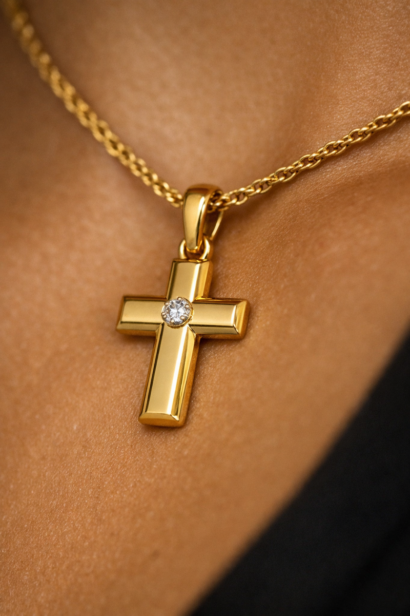 Gold cross pendant with diamond center on rope chain, authentic solid gold jewelry.