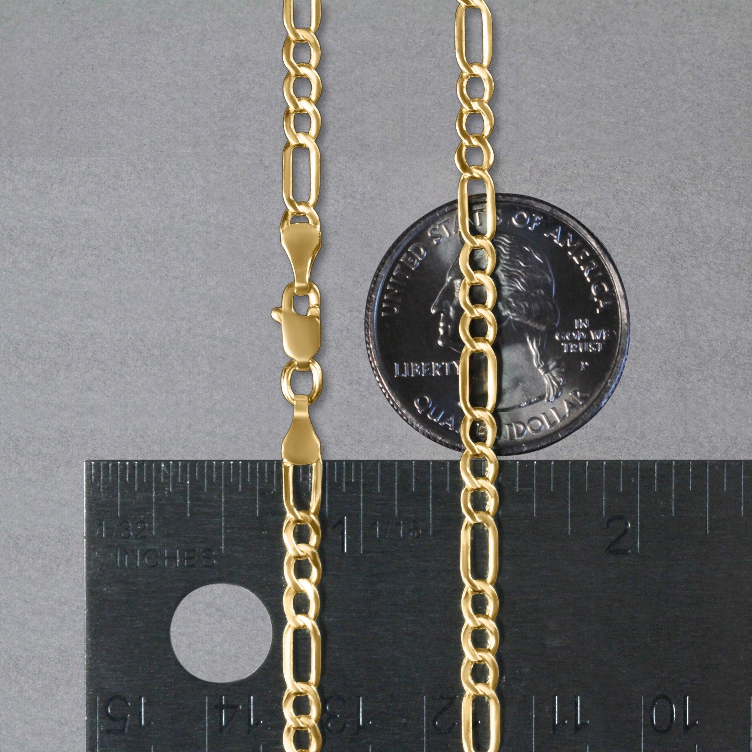 Coiled presentation of 10K yellow gold lite Figaro chain, 3.70mm, showing flexibility and polished shine.