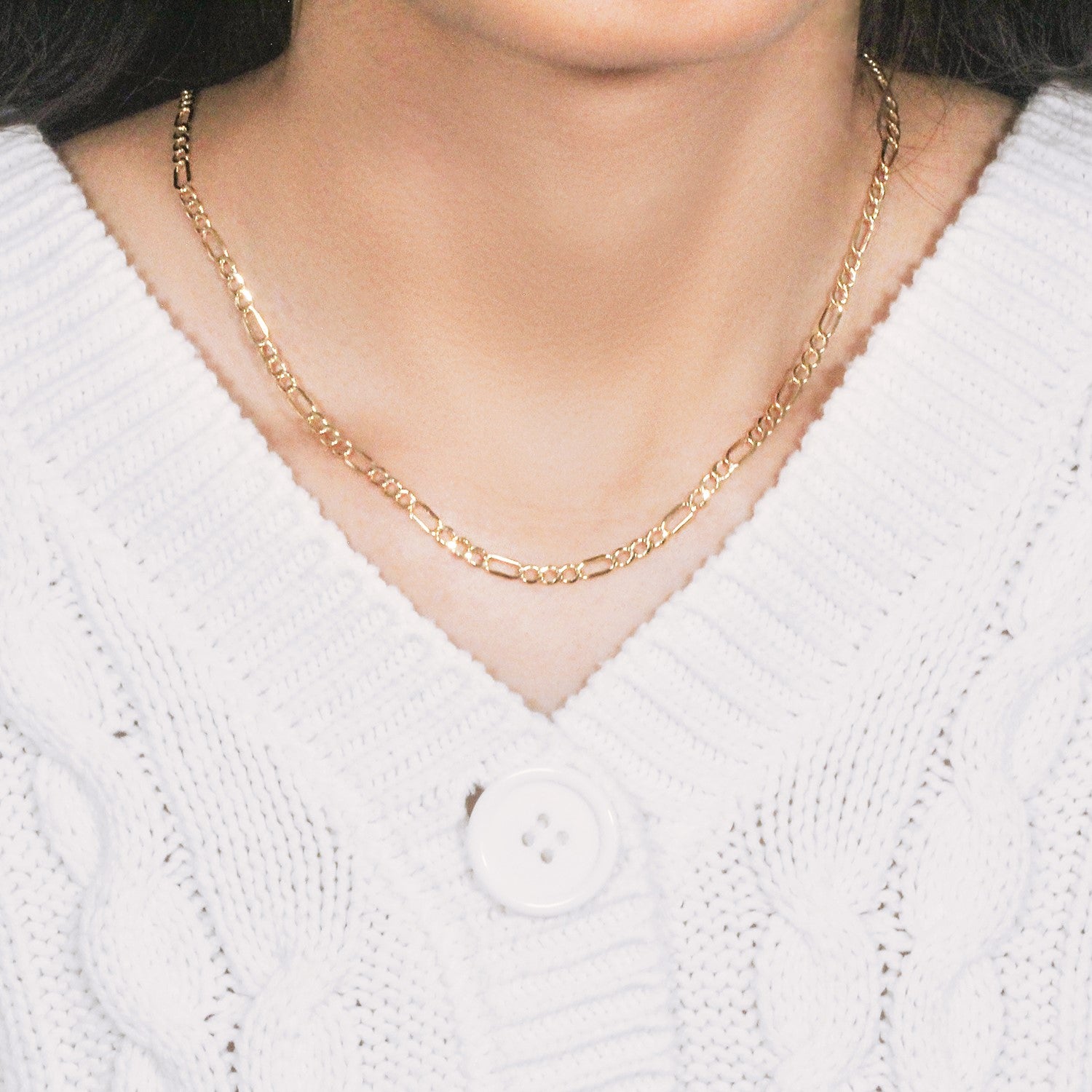 Angled product shot of 10K yellow gold lite Figaro chain, 3.70mm, highlighting warm gold tone and craftsmanship.